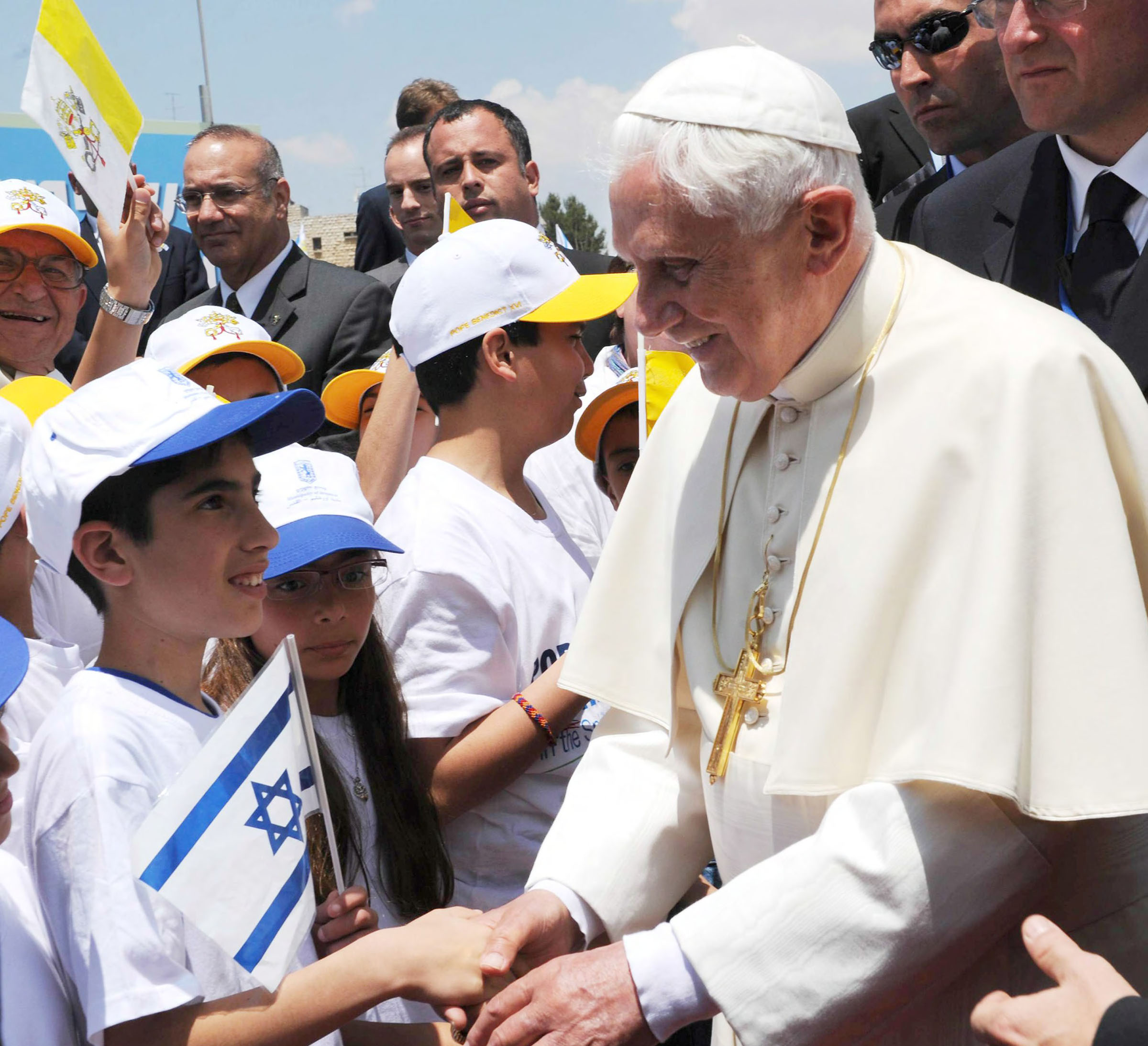 Pope Emeritus Benedict XVI greets children during a visit to Israel in 2009
