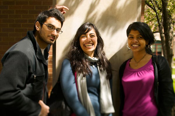Three students smiling at the Lincoln Park campus