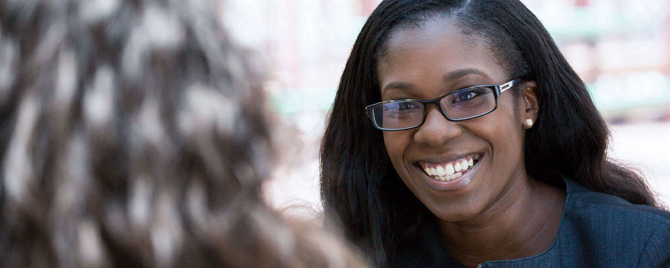Black female adult student, smiling