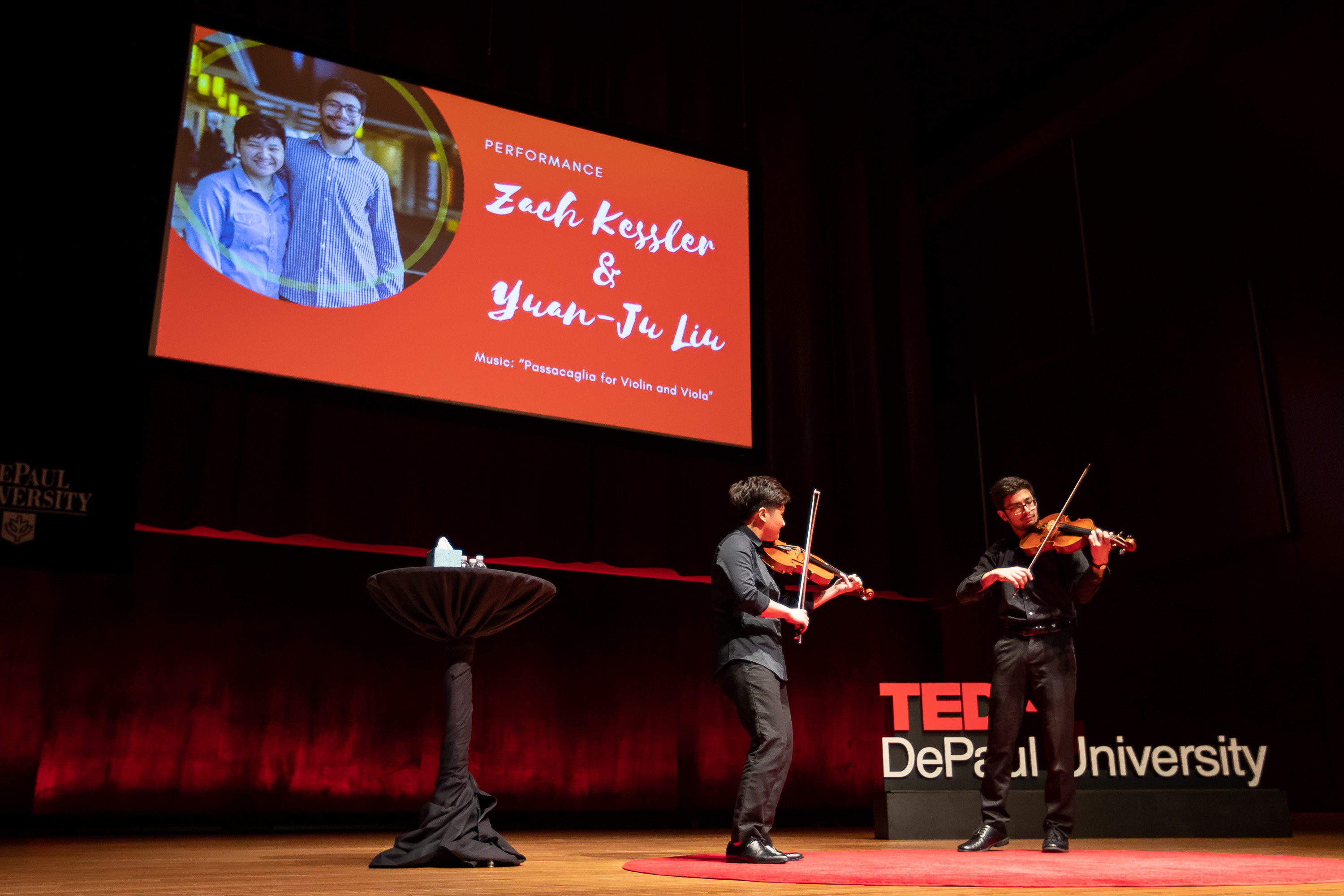 Two violinist perform at TEDxDePaulUniversity