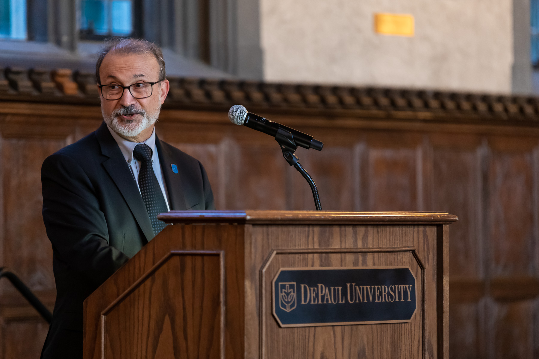 Guillermo Vasquez de Velasco, dean of the College of Liberal Arts and Social Sciences, speaks at the investiture ceremony.