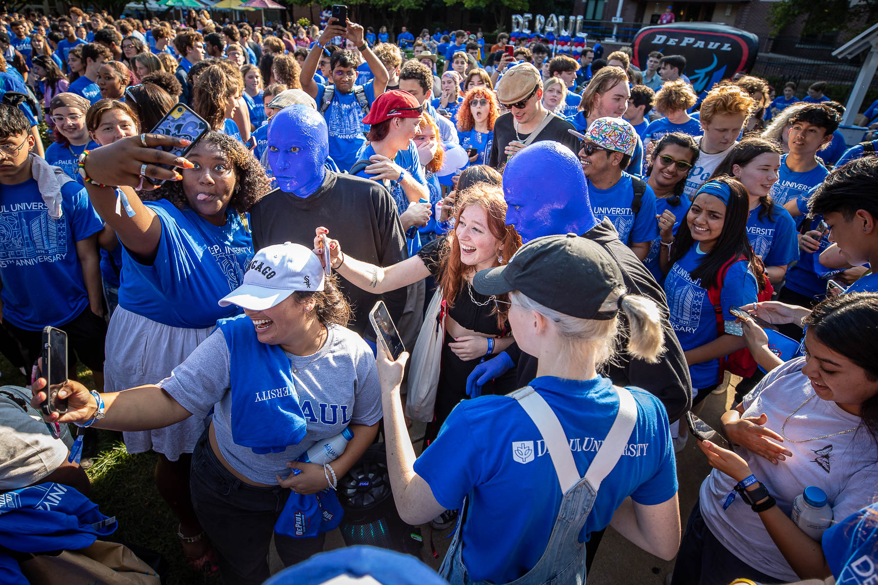 As the Blue Man Group made their way from University Hall to the stage, they posed for hundreds of selfies with enthusiastic students. (DePaul University/Jeff Carrion) 