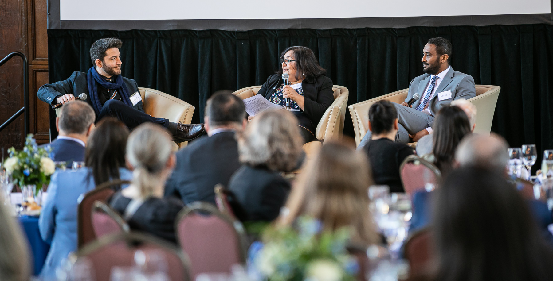Ilja Sichrovsky, left, and Mohamed Abubakr, right, participate in a discussion moderated by Shailja Sharma, professor and chair of International Studies, Refugee and Forced Migration Studies, Global Asian Studies, and Islamic World Studies.