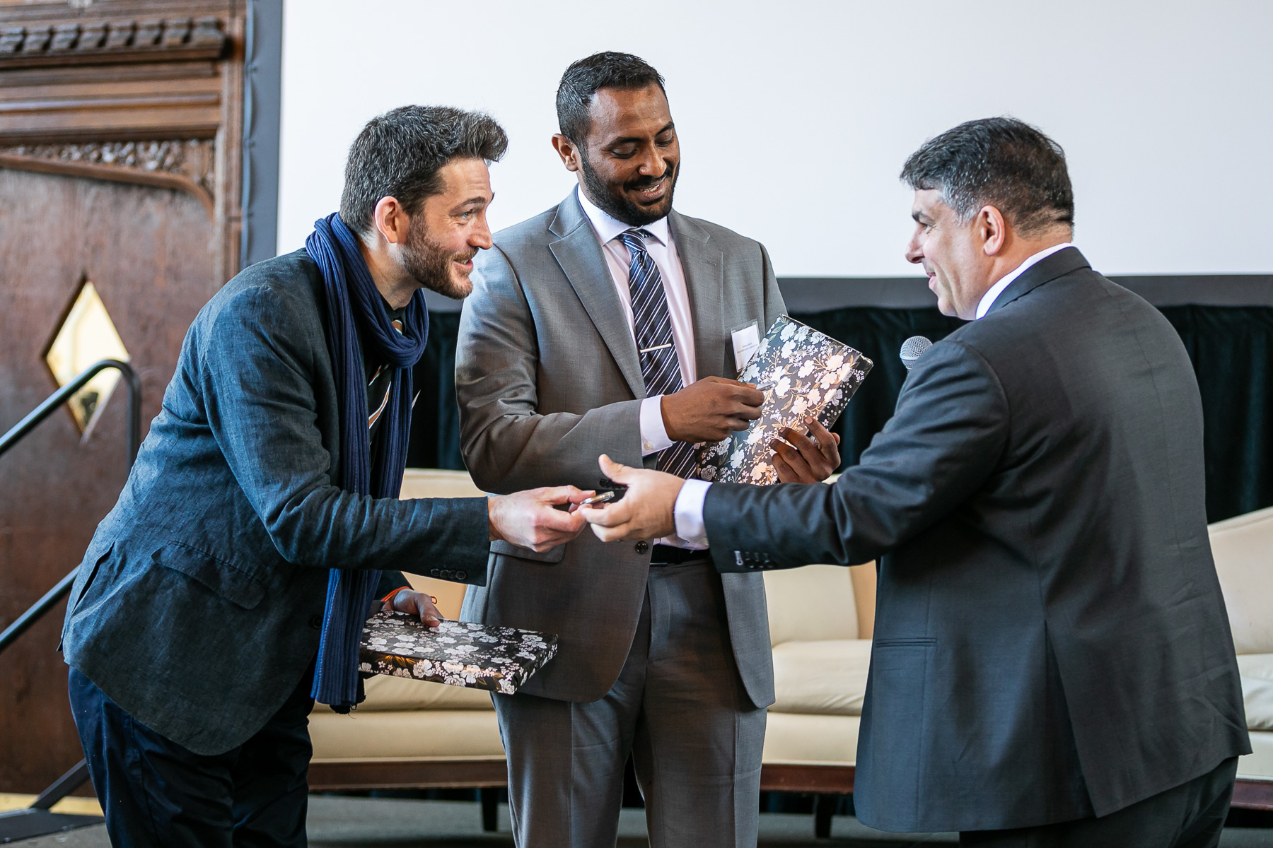 Sichrovsky and Abubakr received DePaul’s Shared Coin from President Manuel at the conclusion of the event.