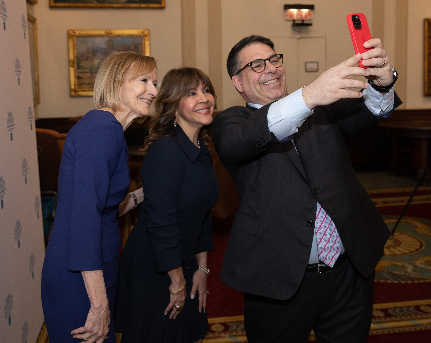A moment of fun. DePaul President Rob Manuel engaged award recipients Judy Woodruff and Sally Ramirez for a quick selfie before the ceremony began. (Photo by Sandy Rosencrans)