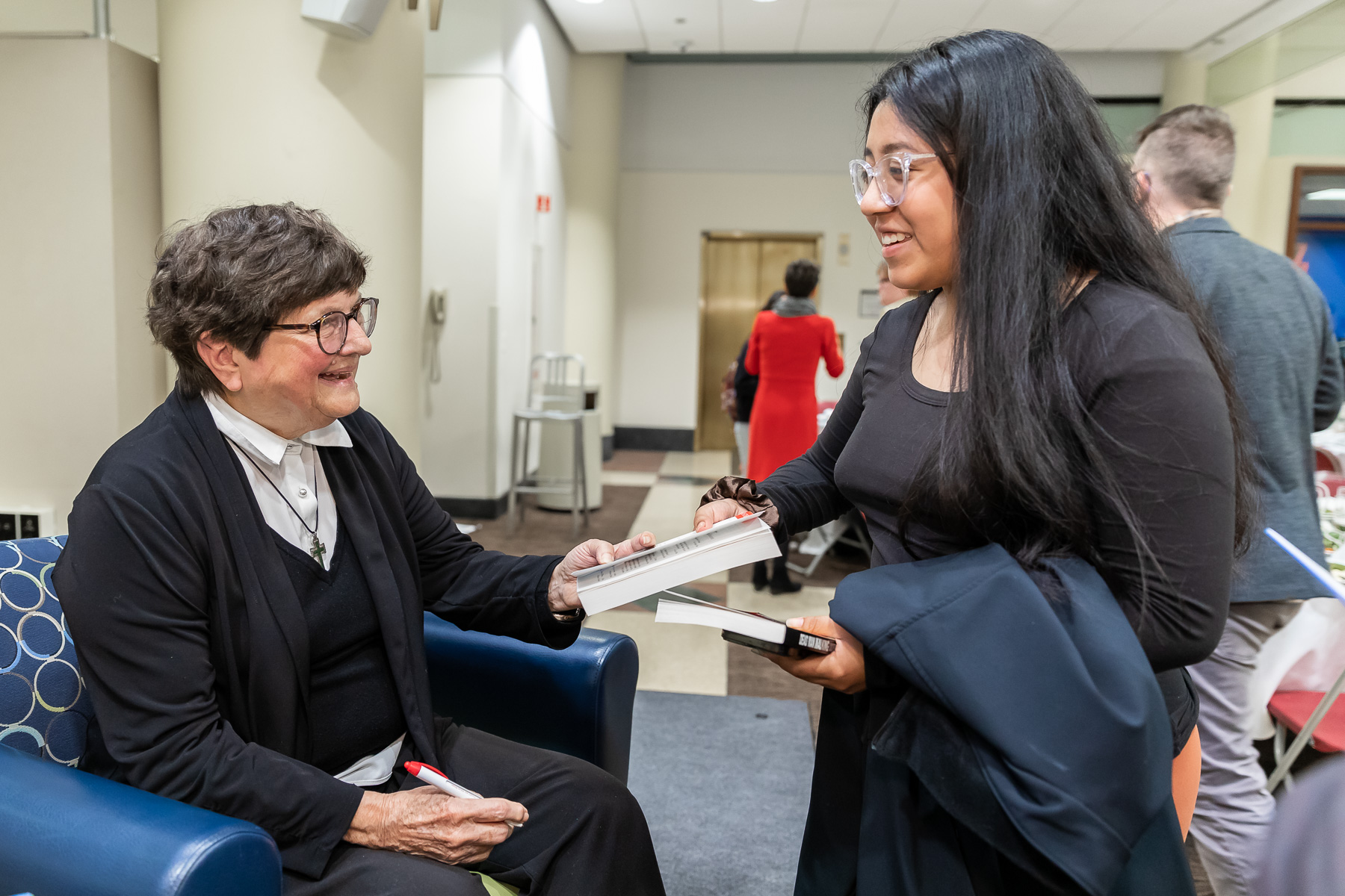 Sister Helen Prejean, C.S.J., chats with a student.