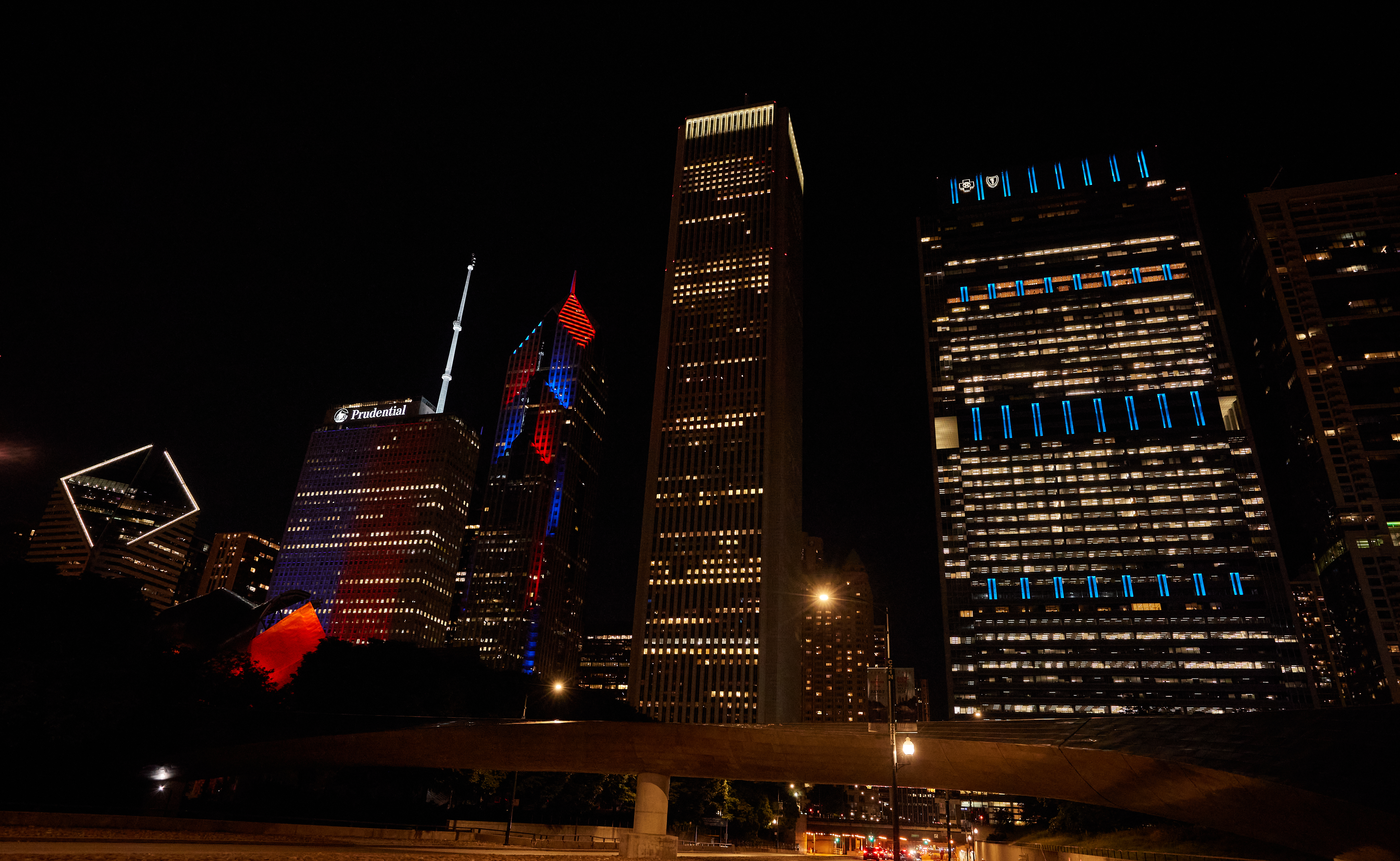 Skyscrapers lit up in red, white and blue