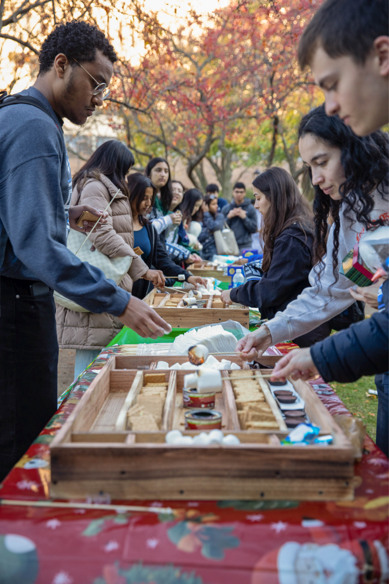 Students at a table with s'mores kits