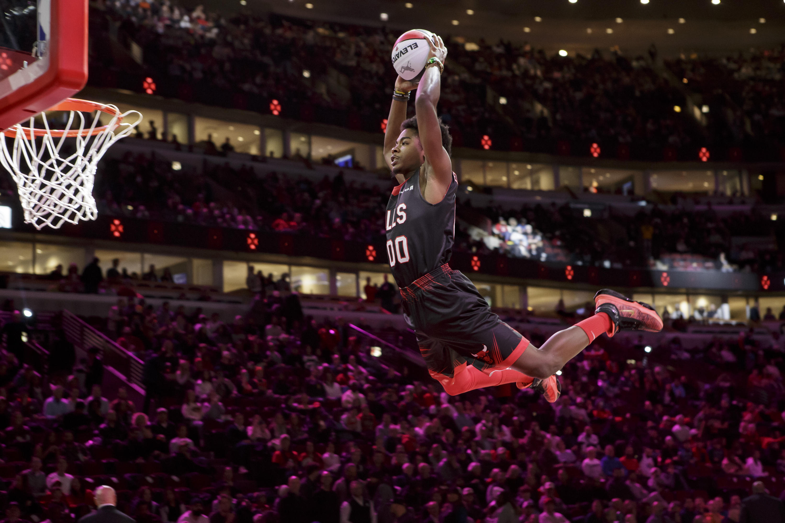 Jamari Grant soars through the air at a Chicago Bulls game as part of the Jesse White Tumblers.
