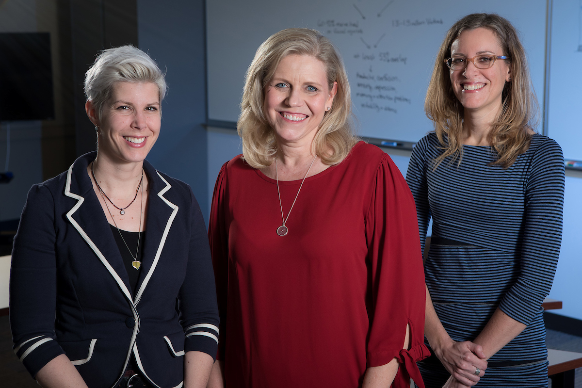 From left to right: Faculty Doris Rusch, Dorothy Kozlowski and Sonya Crabtree-Nelson earned an Academic Initiatives Program grant to raise awareness in Chicago about the intersection of domestic violence and traumatic brain injury. (DePaul University/Jeff Carrion)
