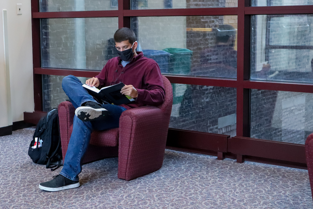 Student reads on campus