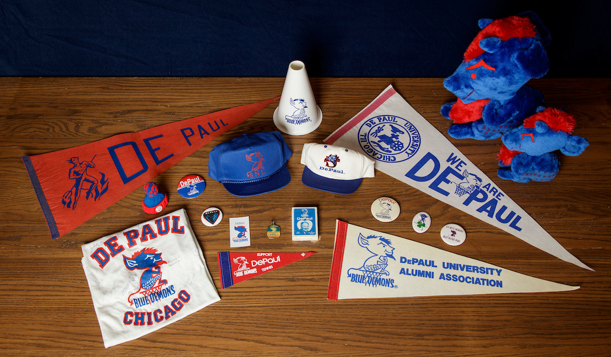 Items from DePaul's Special Collections and Archives display the changing face of the DePaul Blue Demons logo and mascot throughout the years. (DePaul University/Jeff Carrion)