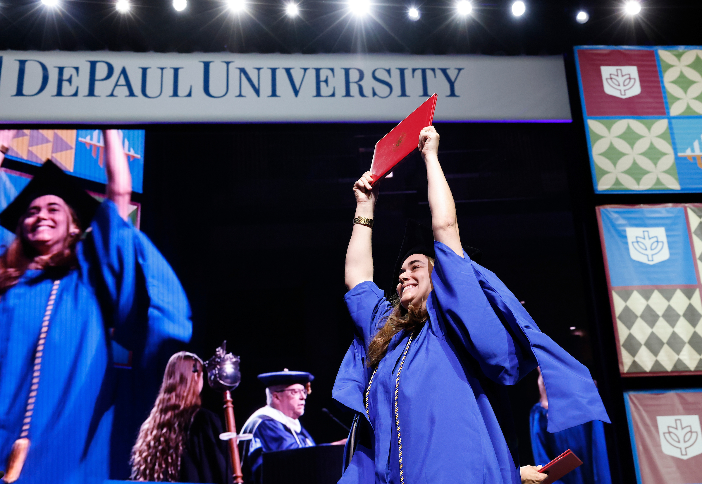 DePaul student crosses the commencement stage.