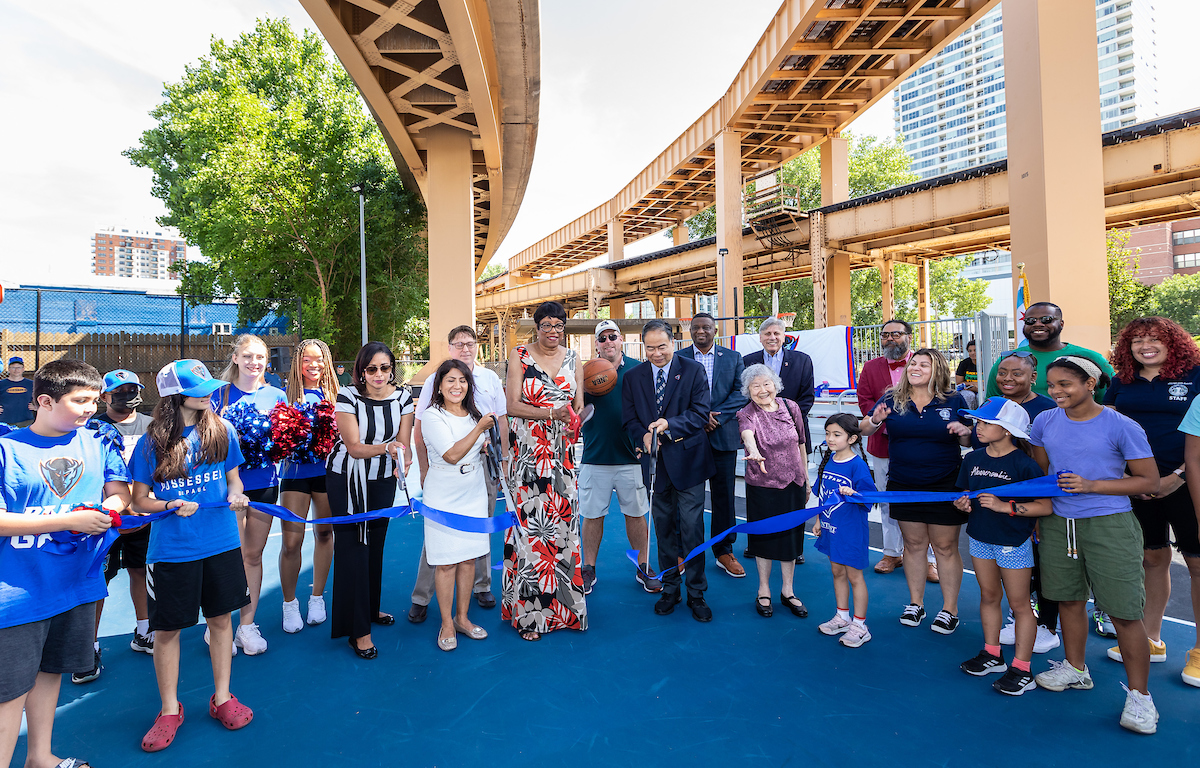Children and community leaders cut the ribbon at Lin Park.