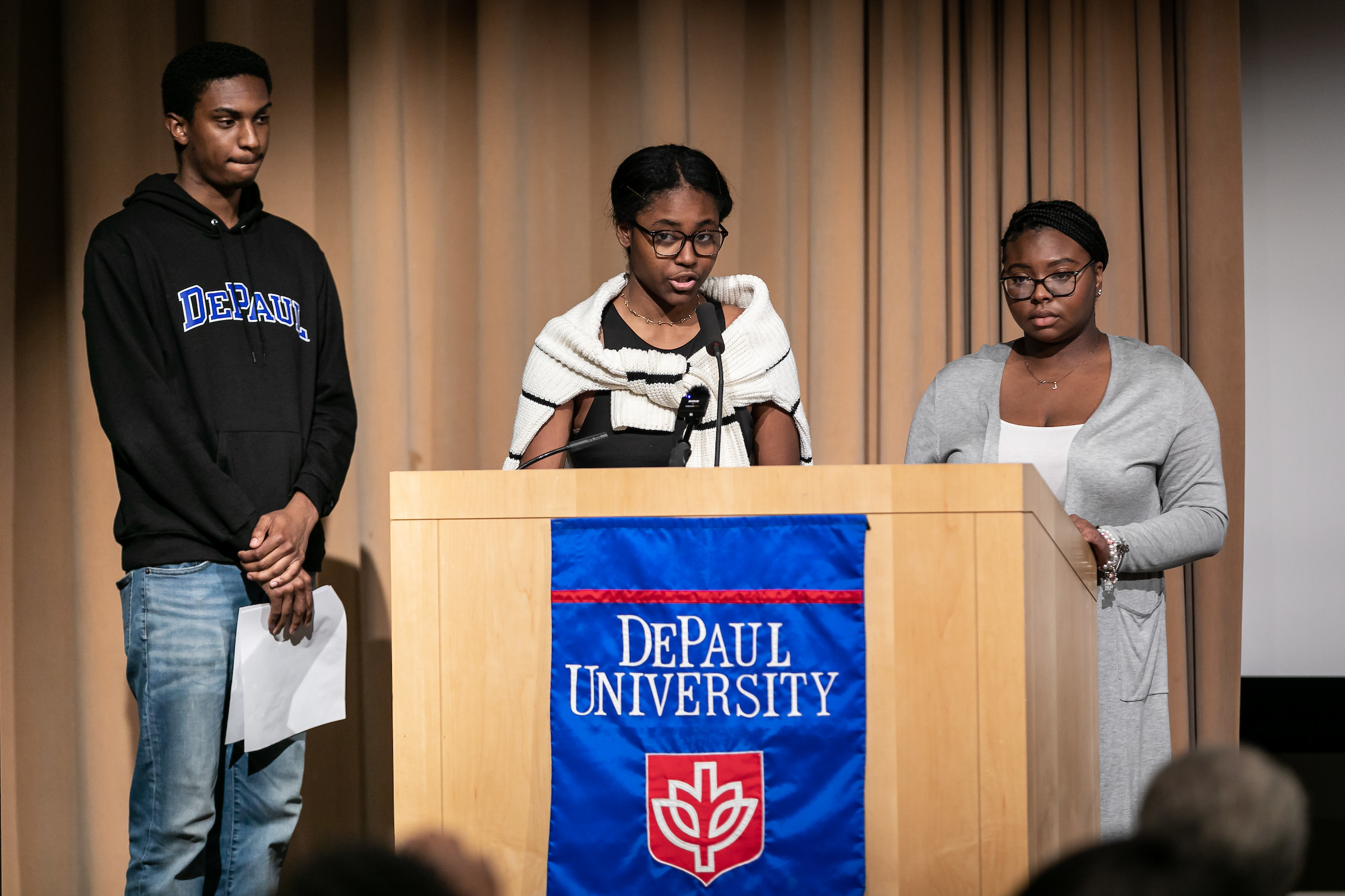 Students speak from podium