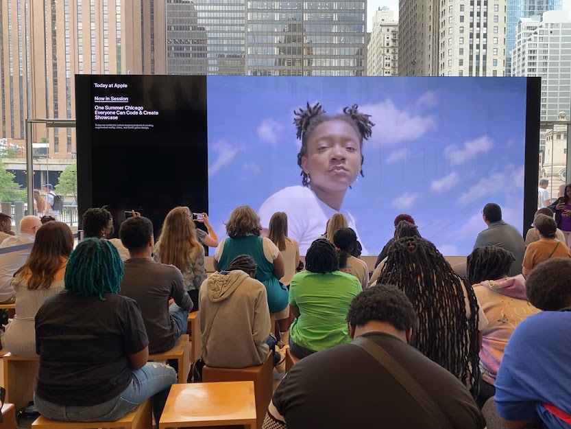 Film plays on a screen in the Michigan Avenue Apple Flagship store.
