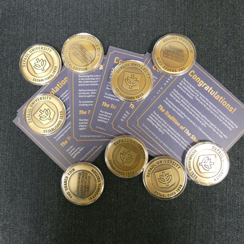 Several Shared Coins and explanatory cards rest on a table.