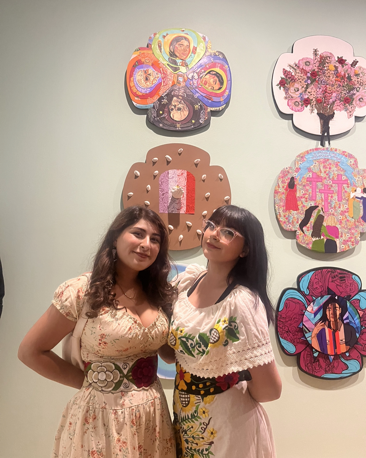 Lupe and Angela Casas standing in front of their flower featured in the Mexican Museum of National Art
