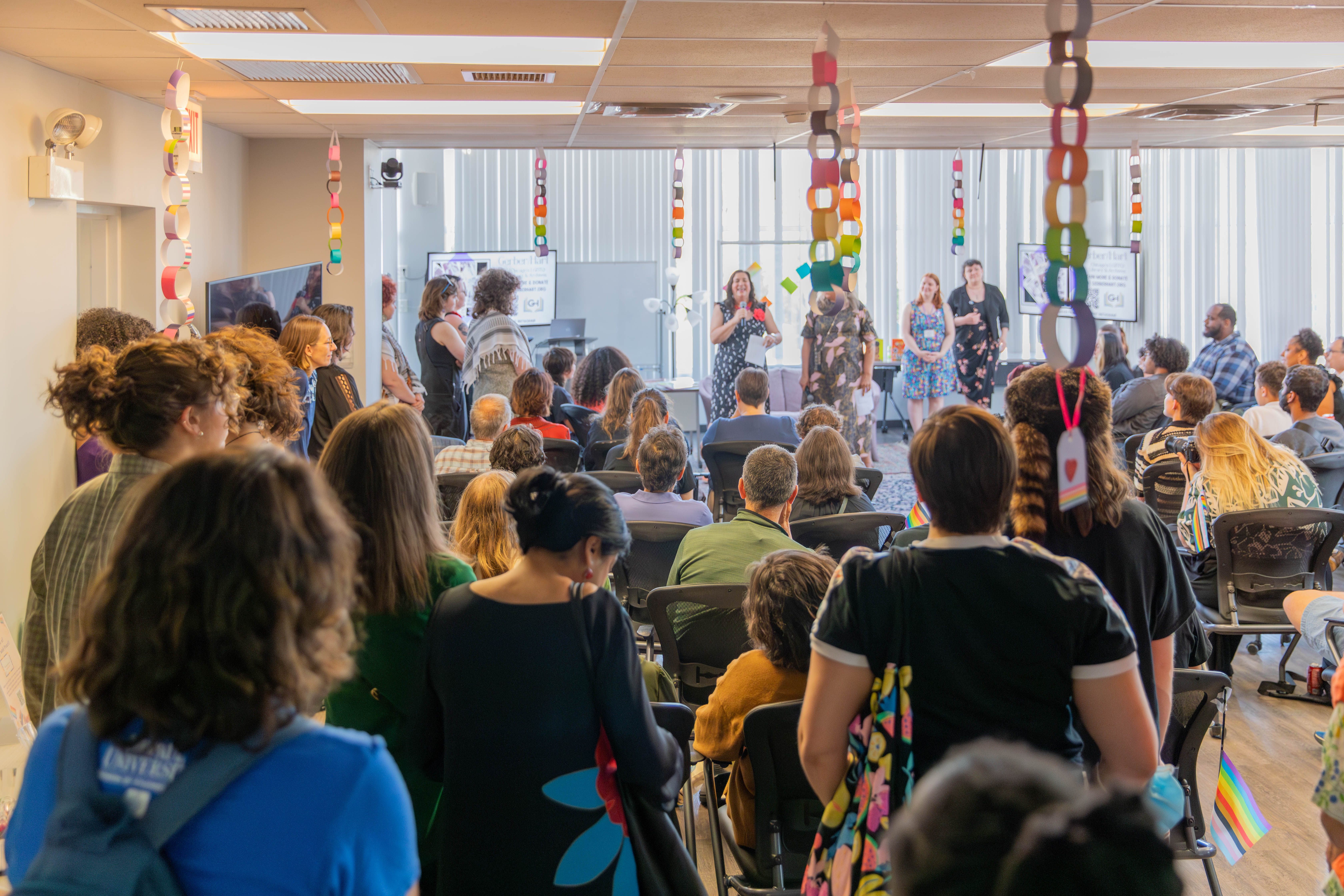 An audience listening to speakers at the Do Say Gay event.