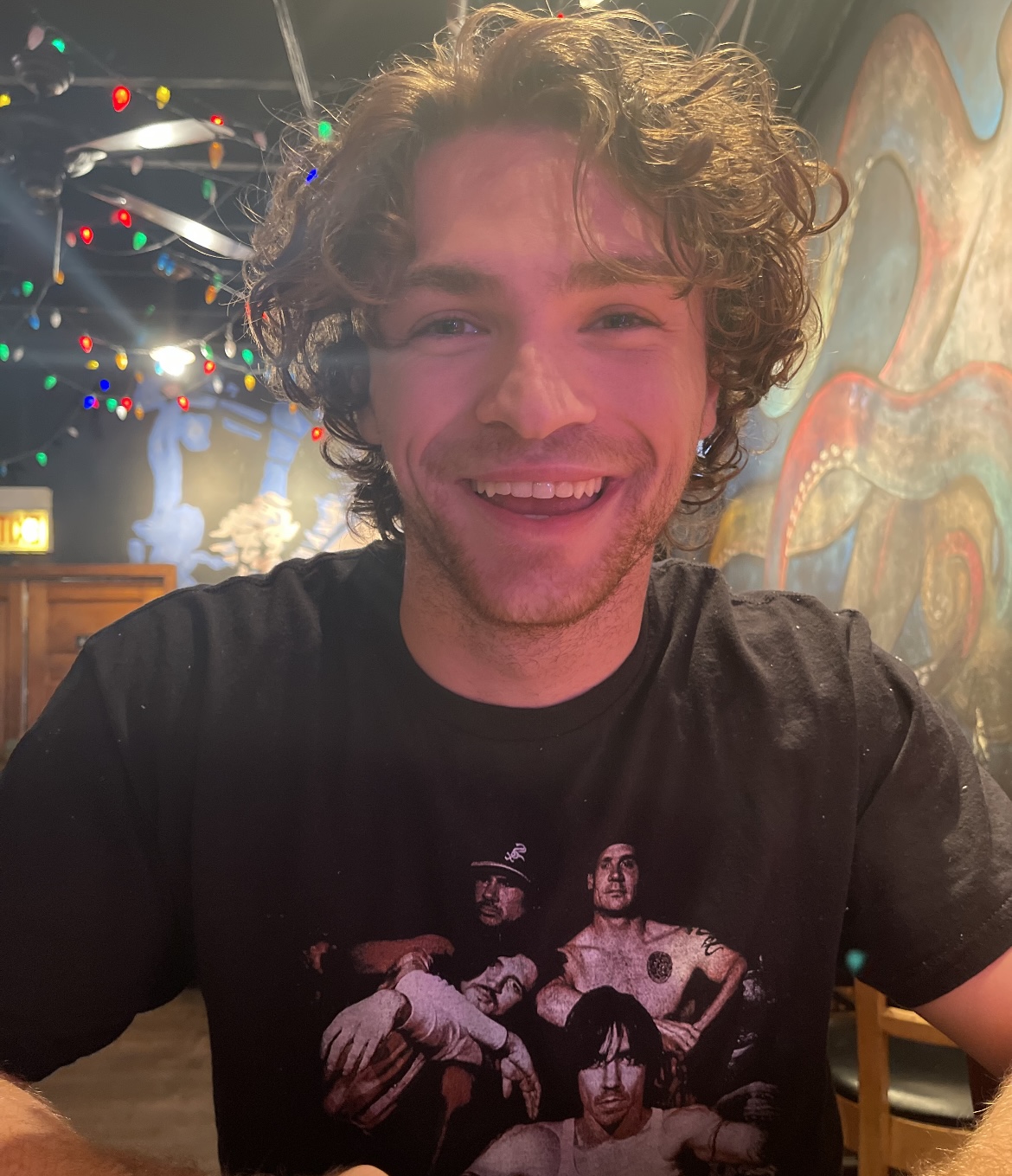 Spencer smiling at a table