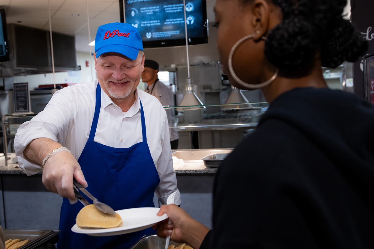 Eugene L. Zdziarski serves food at the Midnight Breakfast