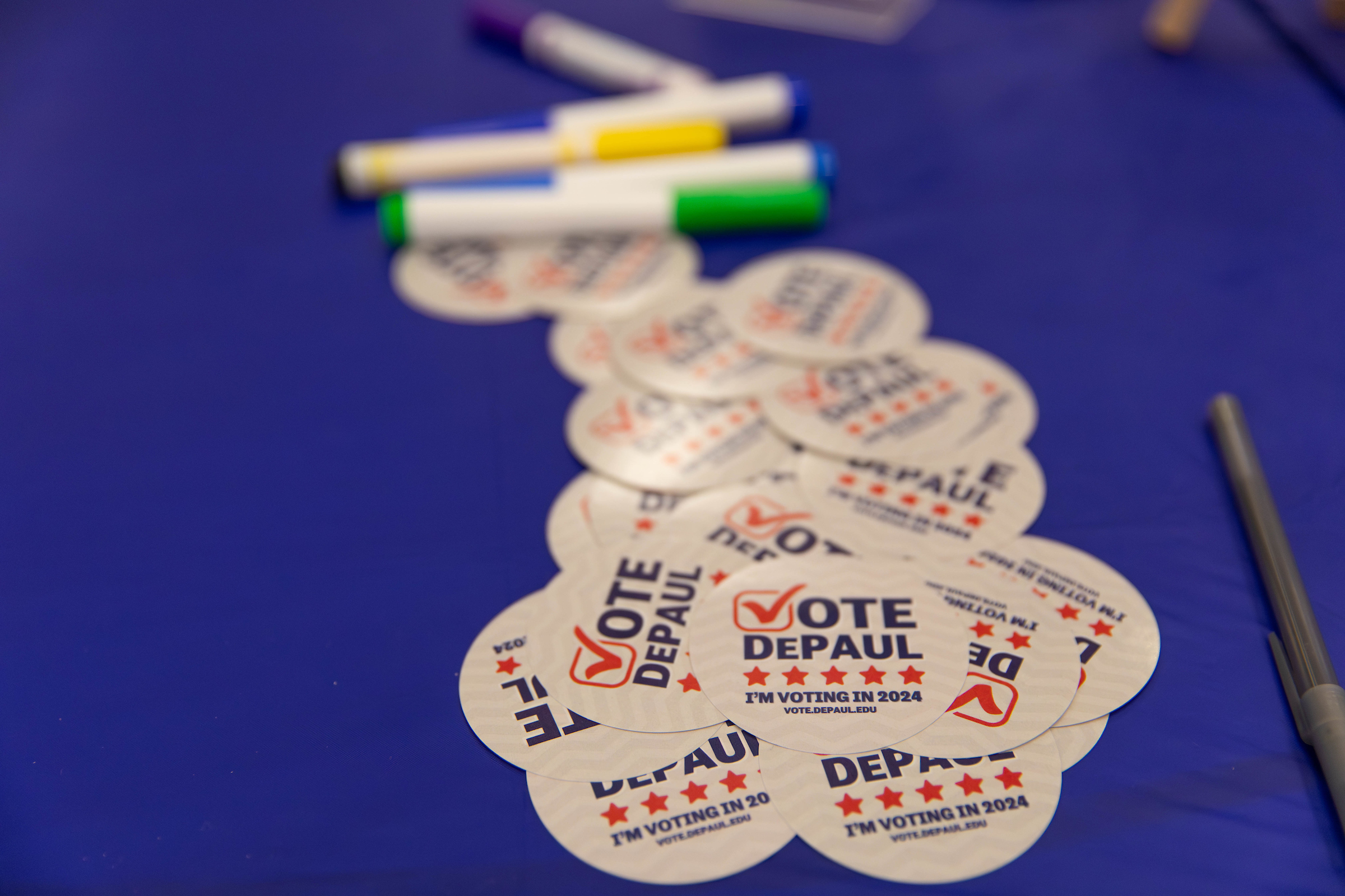 Vote DePaul stickers on a table.