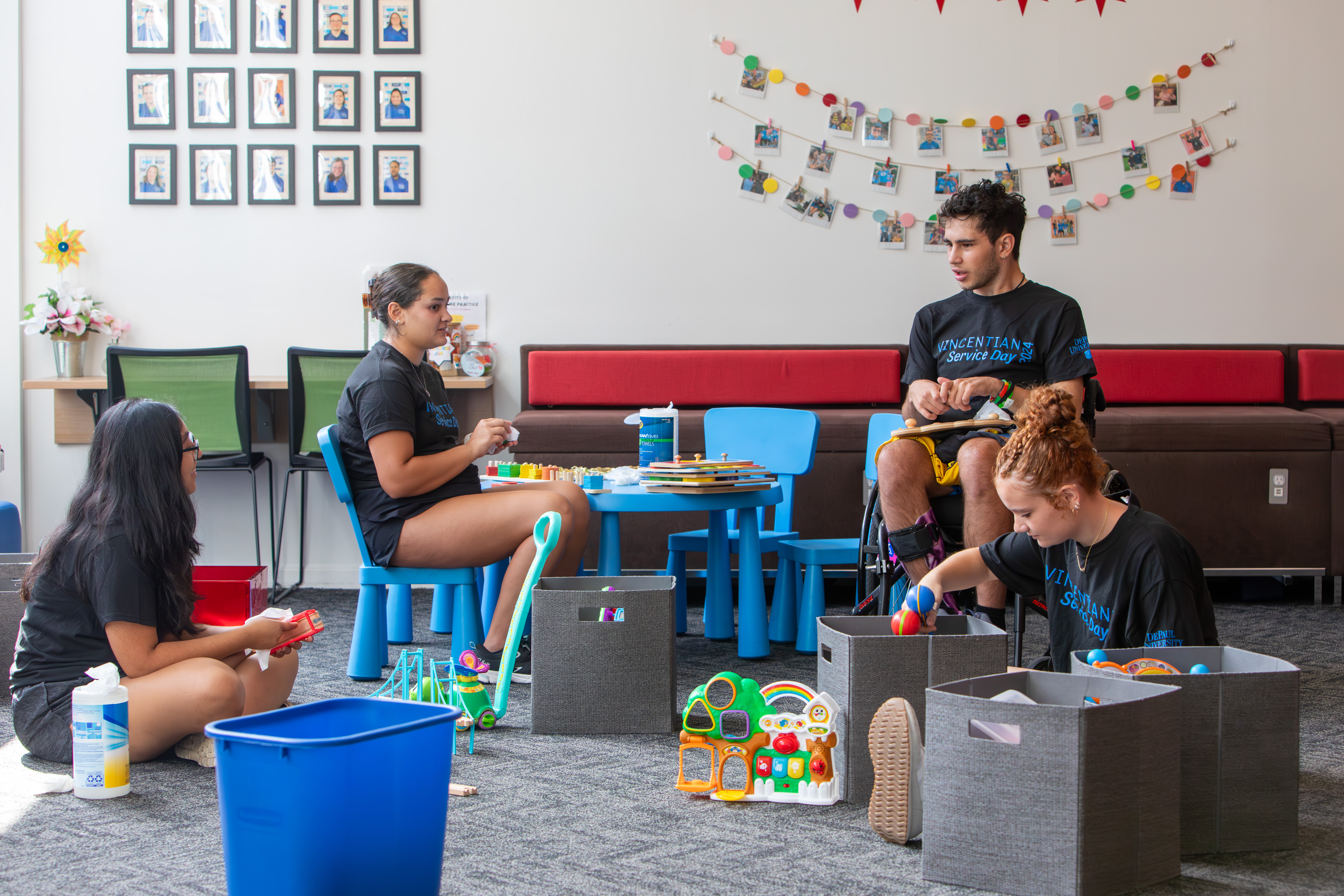 A group of student volunteers cleaning up the facility at Gigi's Playhouse Chicago