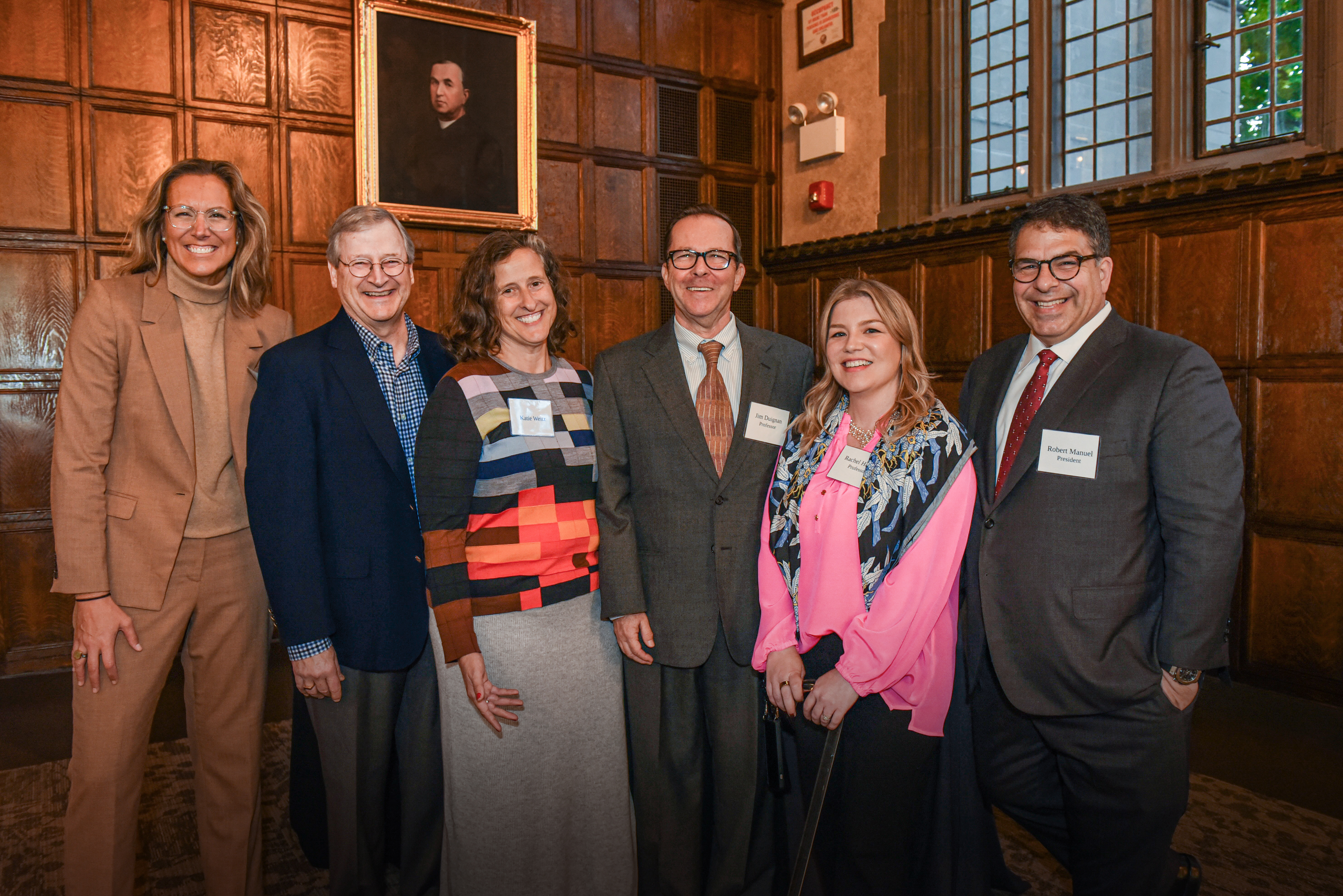 From left to right: Katie Fraumann, senior vice president, advancement and external relations, Wally Weitz; Katie Weitz, a 1999 College of Education graduate with a master of education in teaching and learning; Jim Duignan, founder and director of the Stockyard Institute and chair of the visual art education program in the College of Education; Rachel Harper, assistant director of the Stockyard Institute; and DePaul President Rob Manuel. (Mirela Fratila/DePaul University)