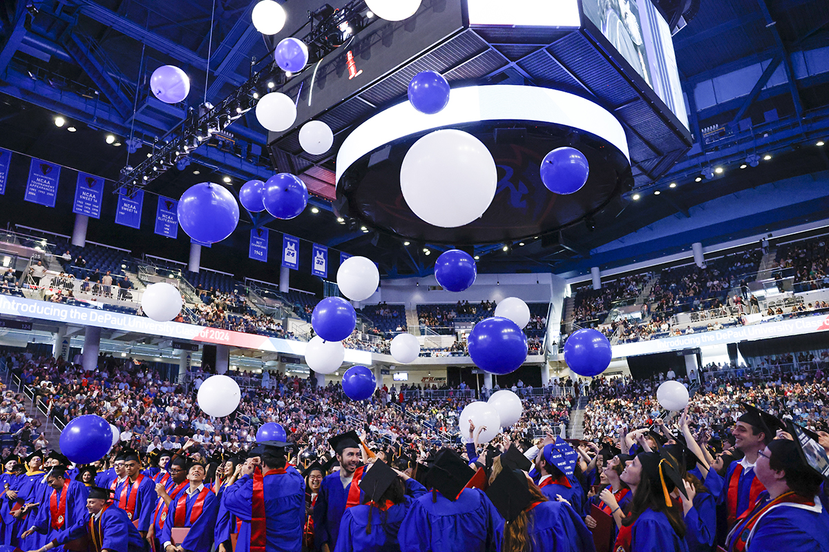 Class of 2024 at commencement ceremony with balloons