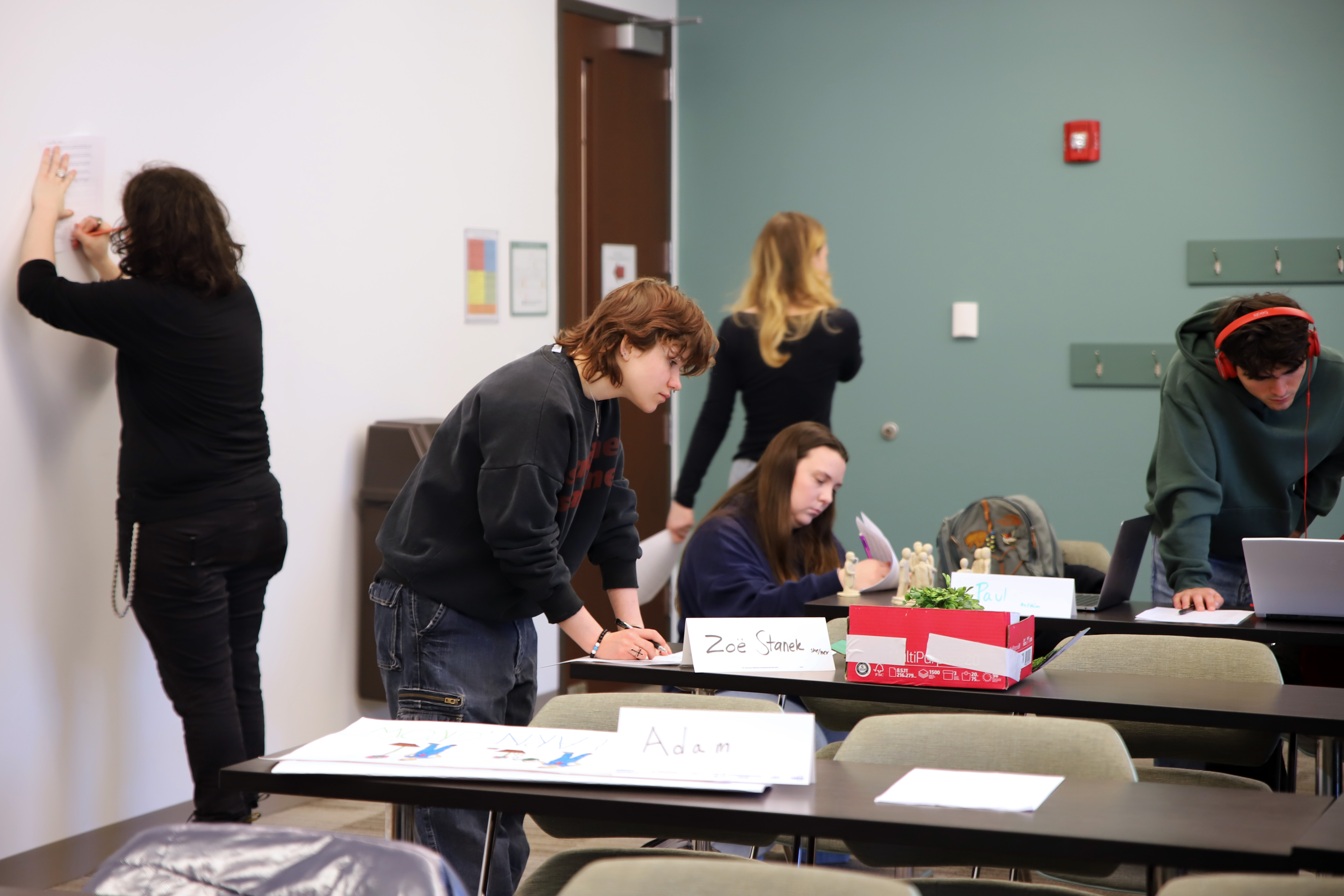 Students look at final projects