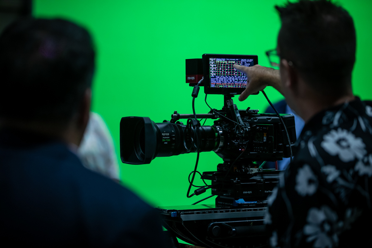 Man showing something on a film camera