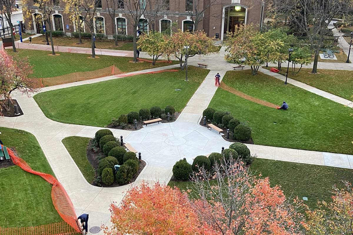 Aerial view of the Lincoln Park Quad with workers removing fences