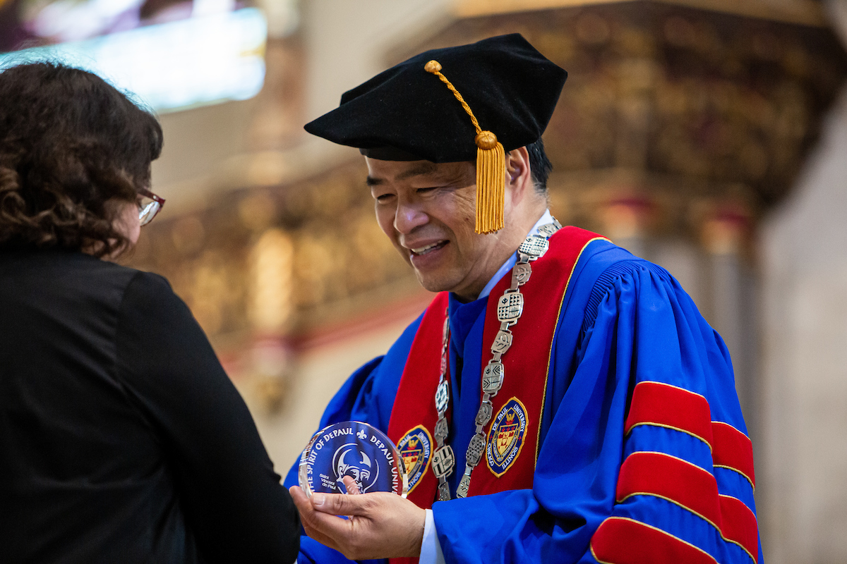 President Esteban bestows a Spirit of DePaul Award during the university's 2019 Academic Convocation