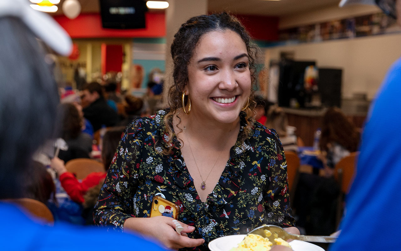 Senior Gisselle Cervantes has been selected as a Student Laureate by The Lincoln Academy. Cervantes, is seen here, attending last year's midnight breakfast during final exam week at Lincoln Park Campus. (DePaul University/Randall Spriggs)
