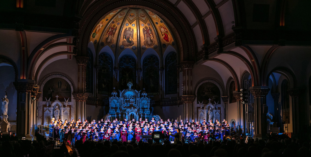 The DePaul Community Chorus and student musicians from the School of Music fill the Saint Vincent de Paul Parish Church with music and song during the annual Christmas at DePaul performance