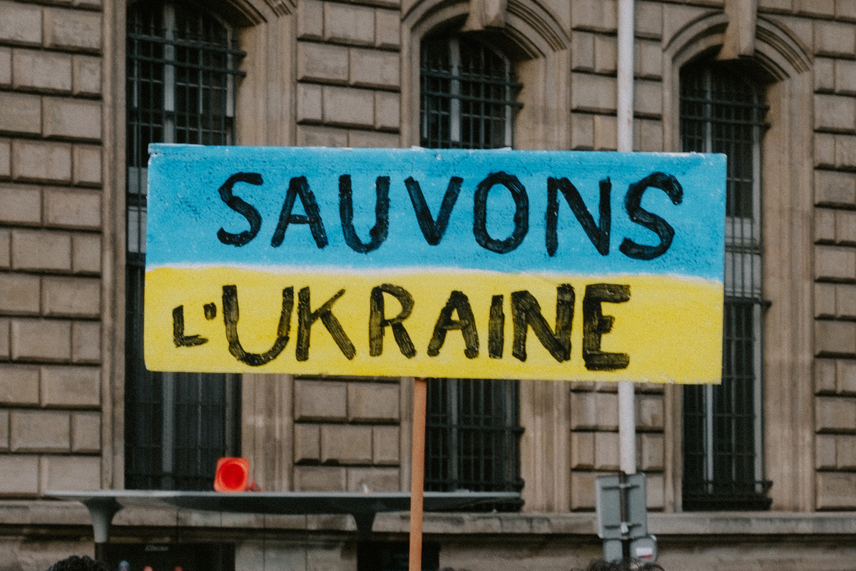 A French sign urges, Save Ukraine