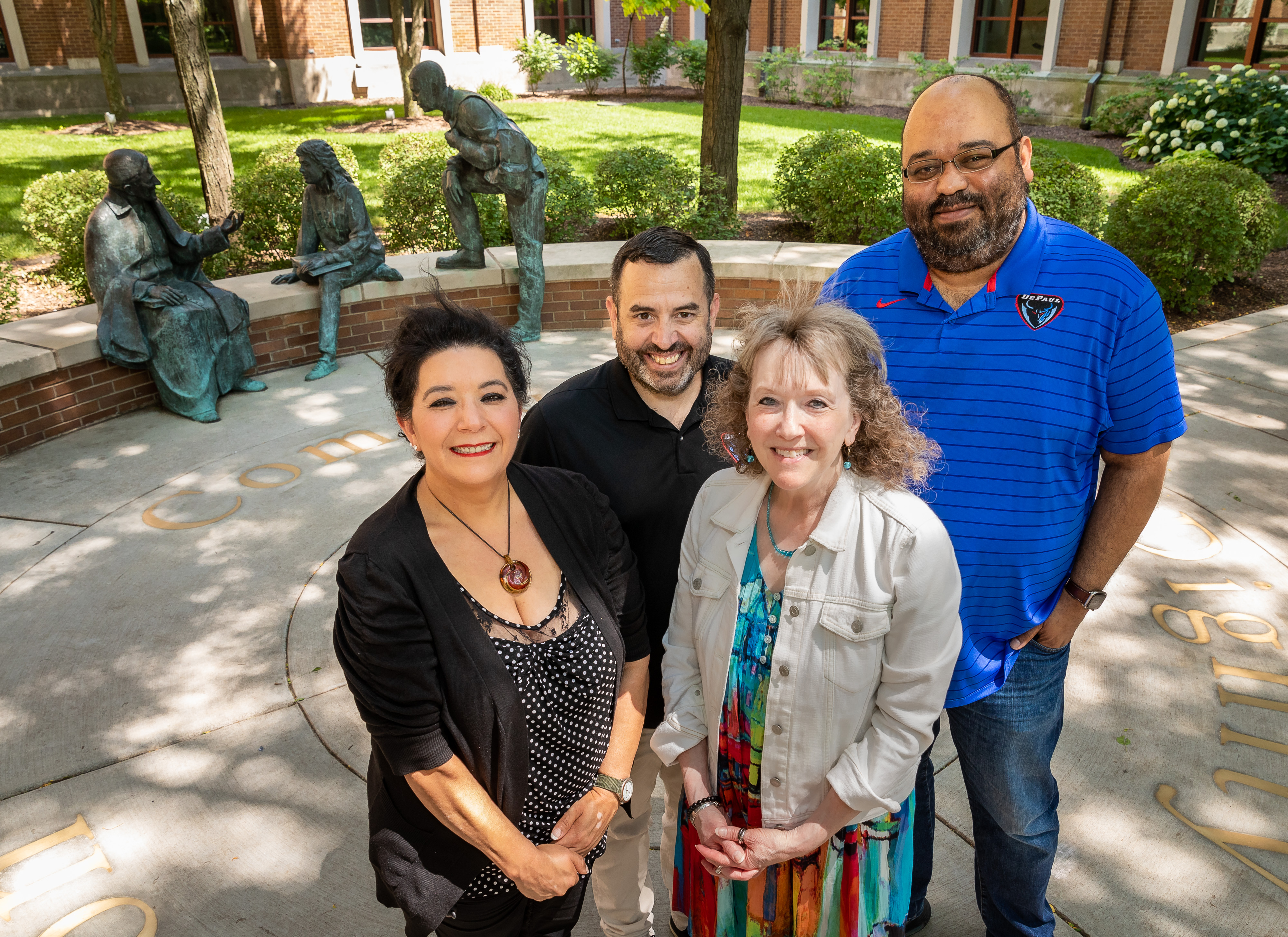 Left to right, Aurora Chavez, Rick Moreci, Nancy Grossman, and Rod Waters, recipients of the 2022-23 Spirit of DePaul Award, June 30, 2022, in Saint Vincent’s Circle. These awardees by their presence and works have made a significant contribution to DePaul University over a period of time and exemplify the mission and values of DePaul University. Not pictured, Jay Baglia and Michael Wright. (DePaul University/Jeff Carrion)
