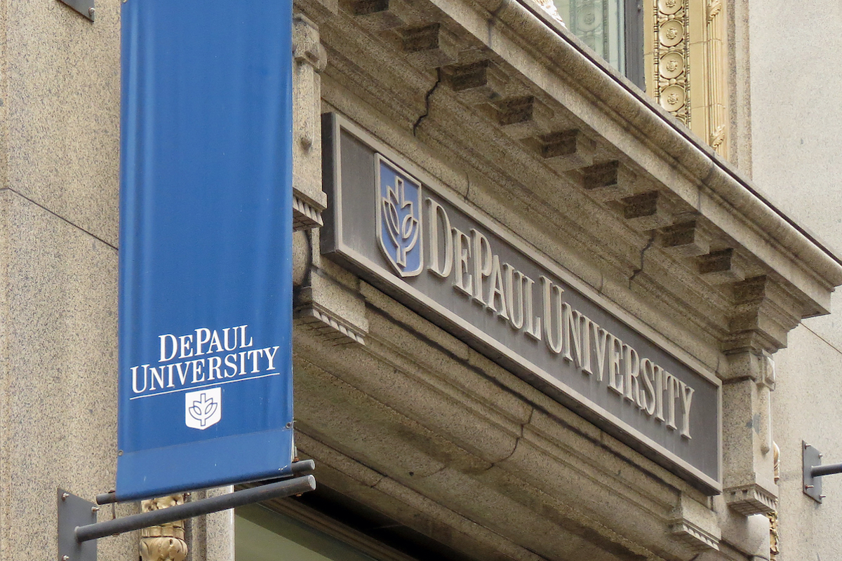 Banner with DePaul University's name and logo hangs from a building