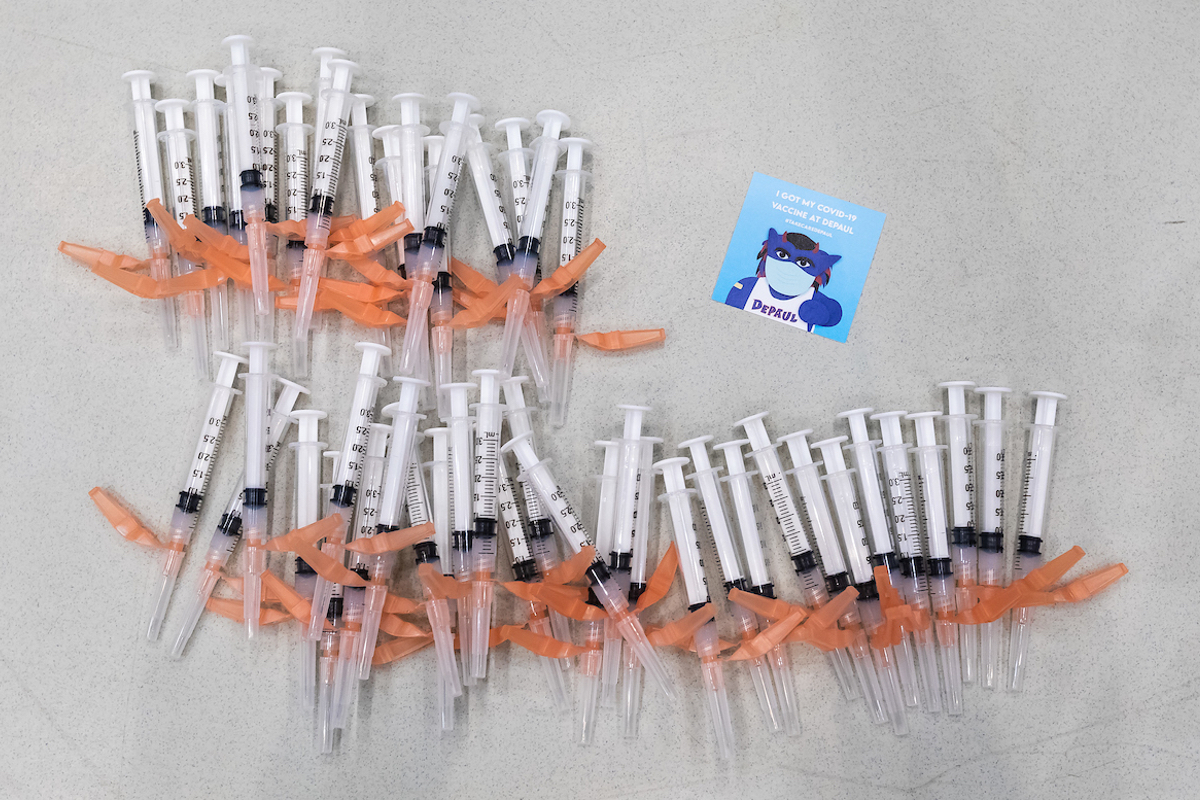 An array of vaccines next to a Blue Demon vaccine sticker 