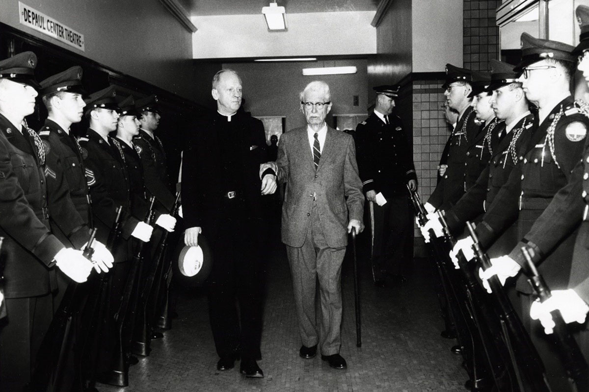 Fr. Theodore J. Wangler, C.M., walks with Frank J. Lewis at the dedication of the Frank J. Lewis Center on May 2, 1959.