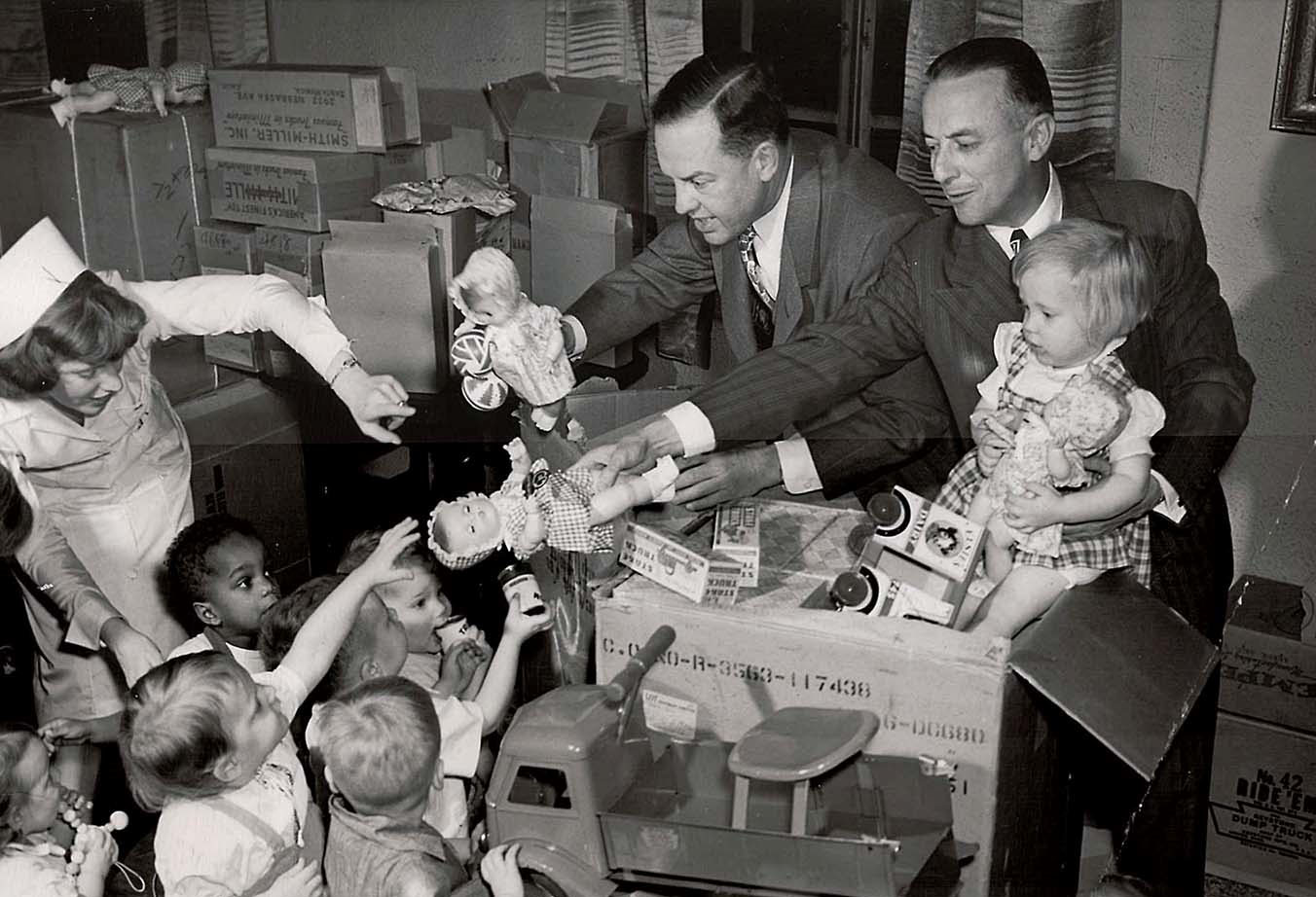 Children receive donated toys on December 23, 1948, at the St. Vincent’s Infant Asylum (Orphanage), which later merged with the DePaul Day Nursery and Settlement House to become the St. Vincent de Paul Center.  