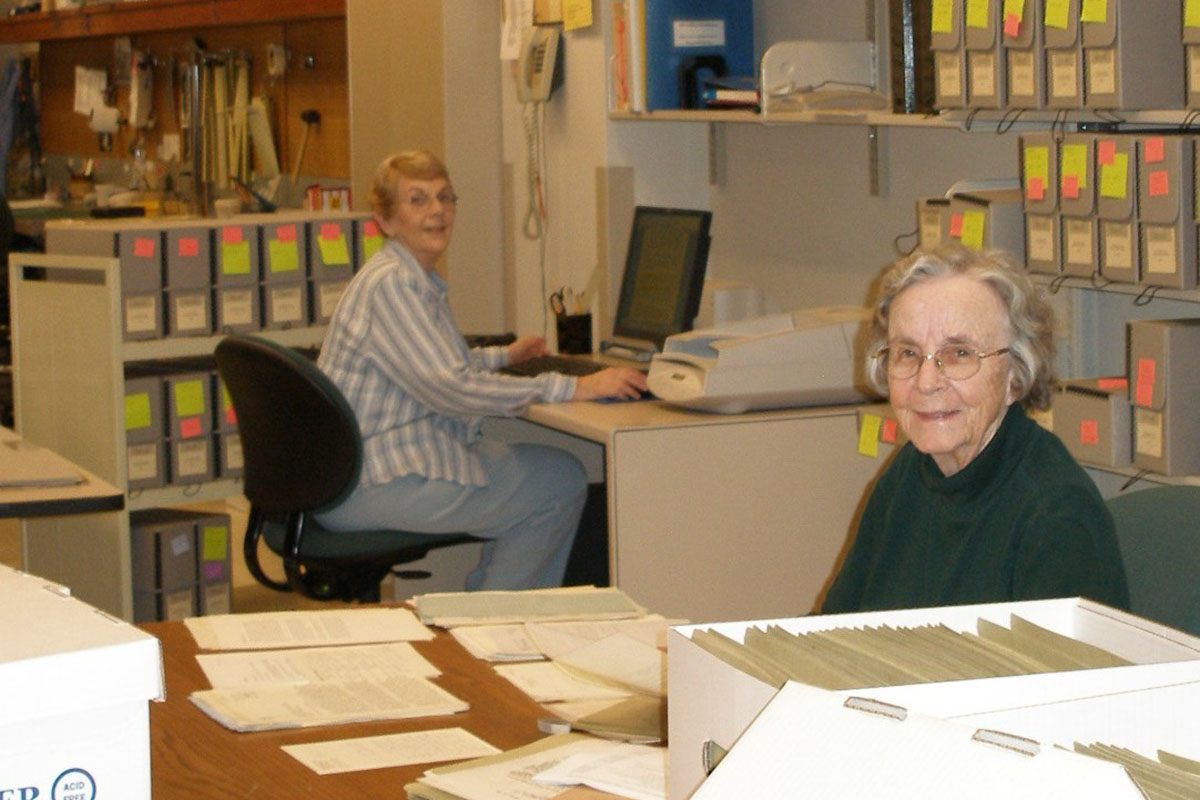 Retired faculty members Ellin Kelly (English) and Pat Wagner (Nursing), arrange and describe collections from the DeAndreis-Rosati Memorial Archives, spring 2006