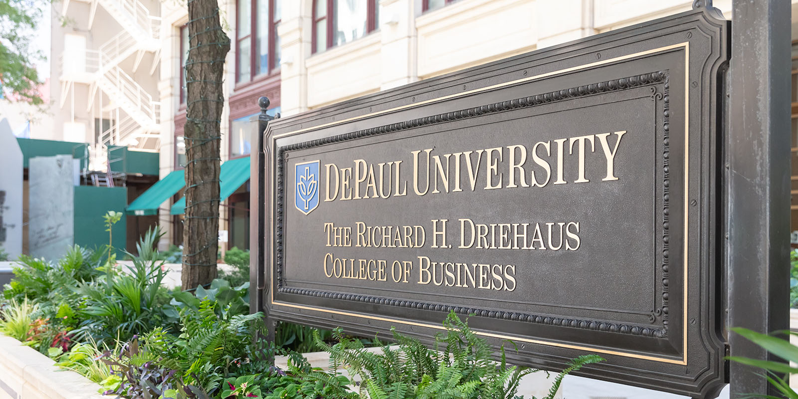 Sign of DePaul Driehaus College of Business outside their building in downtown Chicago