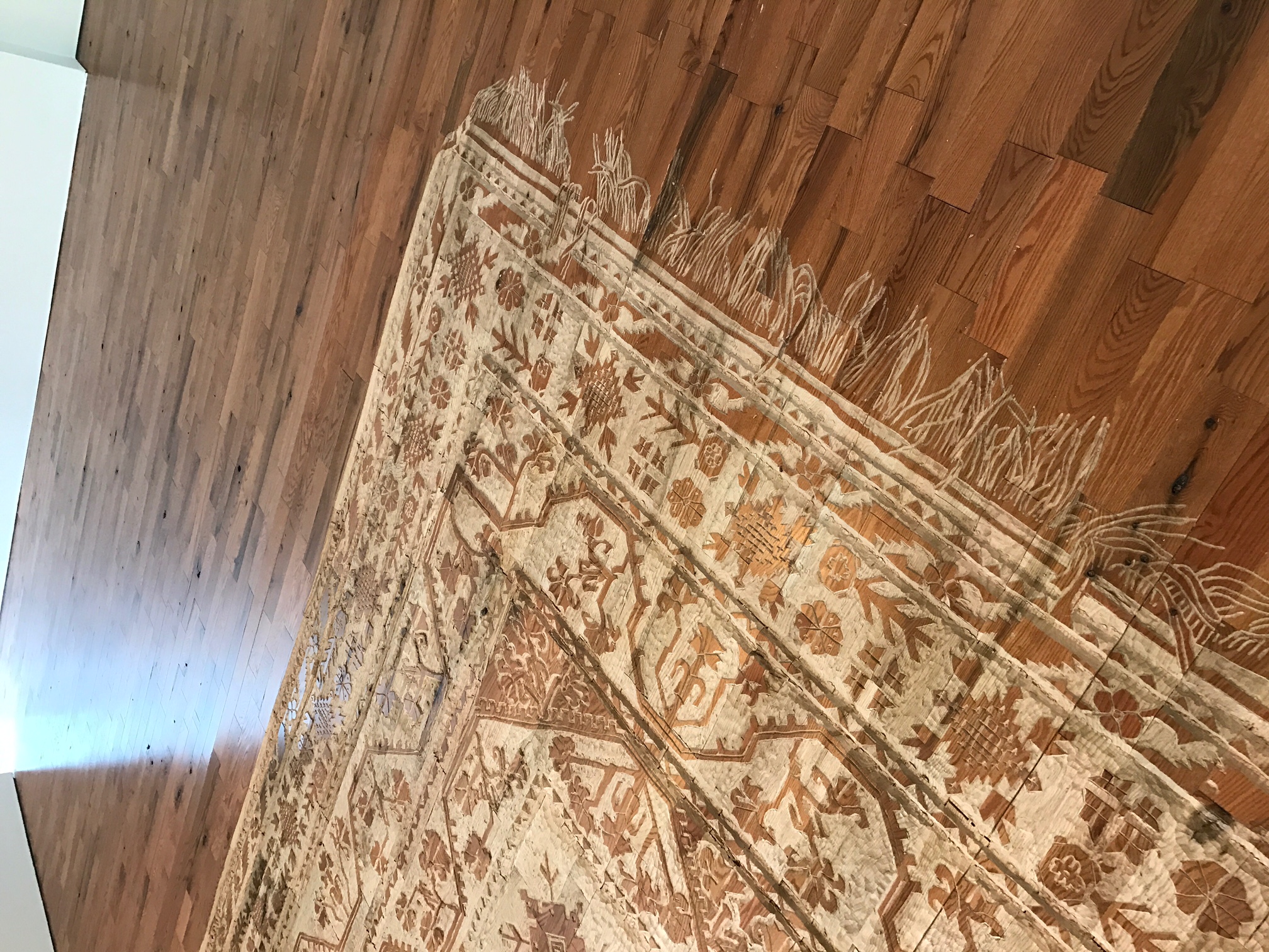 "Childhood Memories, 2017/2023–24" - Artist’s mother rug carved into oak floor.