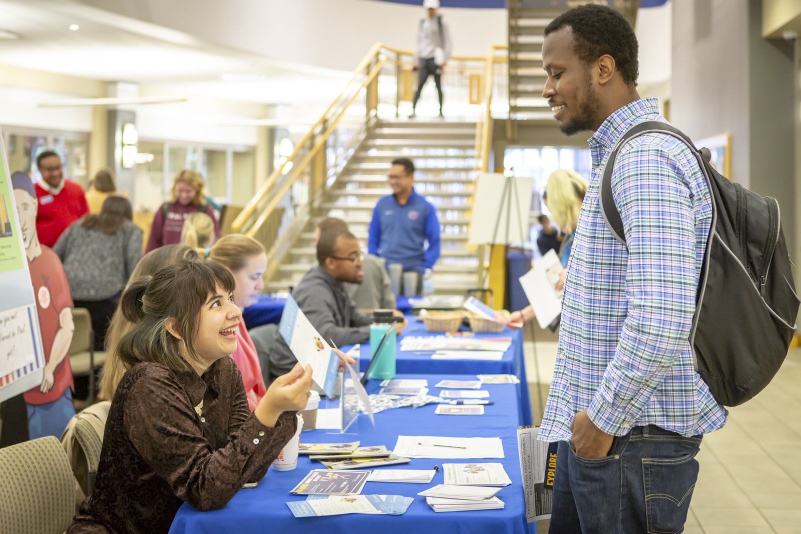 Laura Aranda, Community Service Scholarship Program Coordinator, talks with a student at the 2018 Scholarship Fair Laura Aranda, Community Service Scholarship Program Coordinator, talks with a student at the 2018 Scholarship Fair