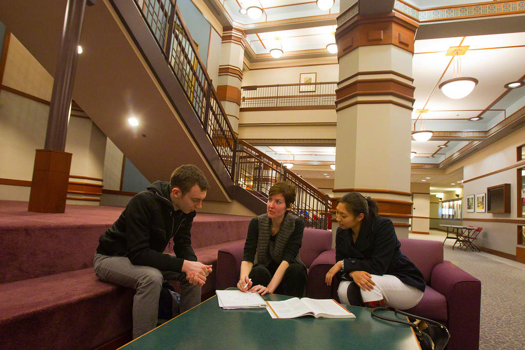 Students discussing class work in the loop campus building.