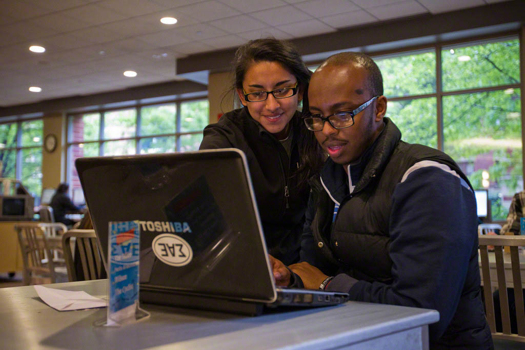 Two students looking at a computer screen at the Student Center.