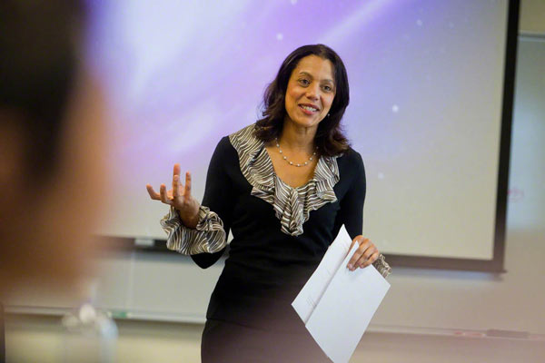 Professor speaking in front of a classroom