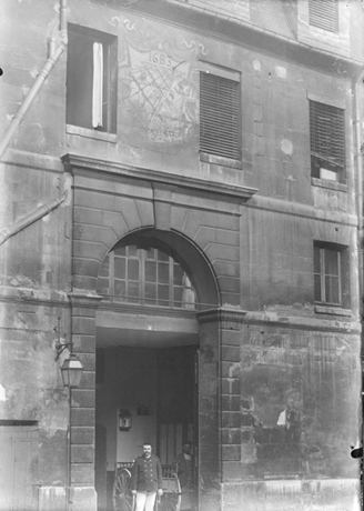 Exterior view, cour d’honneur, entranceway, sundial, guard