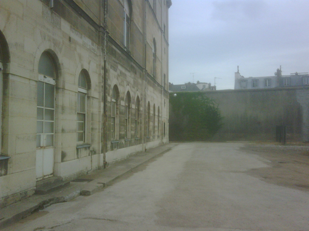 Exterior view, infirmary wing, prison wall